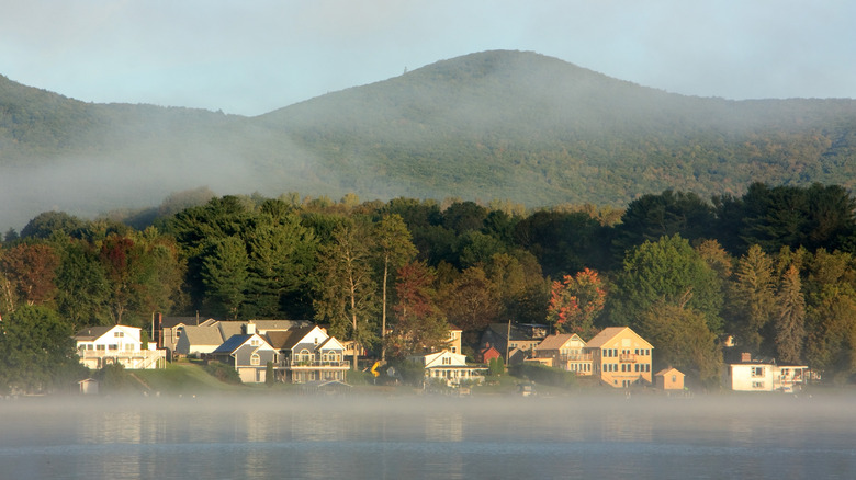 Lakefront homes in Pittsfield, Massachusetts with mountains in background
