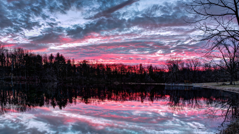 Moody sunset clouds reflected in the pond at Echo Hollow Nature Park, formerly Sodalis Nature Park