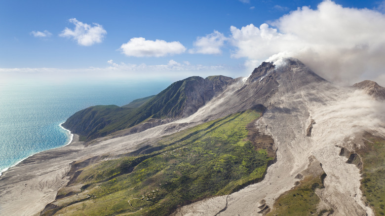 The Soufrière Hills volcano on Montserrat with the Caribbean Sea in the background on a sunny day