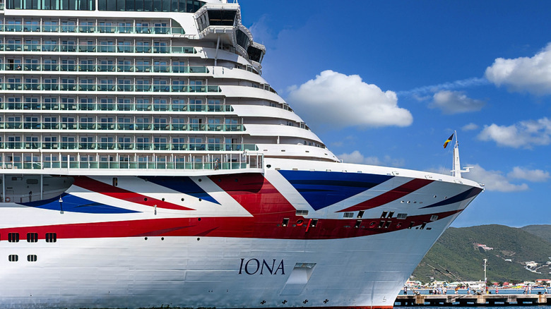 The P&O Cruise ship, Iona, donning the Union Jack, docks in clear blue water in St Maarten
