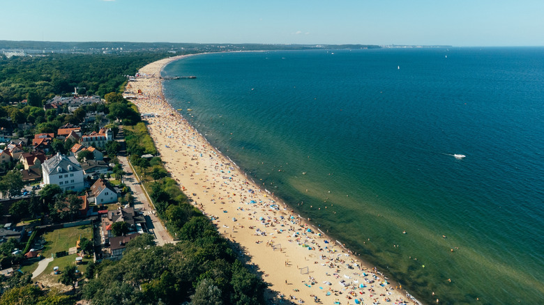 The green-blue waters of the Baltic wash up against the beaches of Sopot, Poland