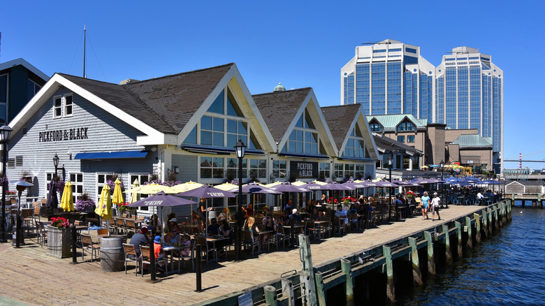 People dining alongside the water in Halifax, Nova Scotia