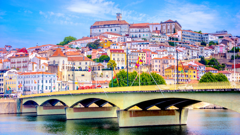 White houses on hill with bridge