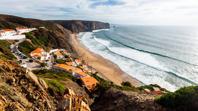 Waves roll into the beach of Arrifana just outside of Aljezur