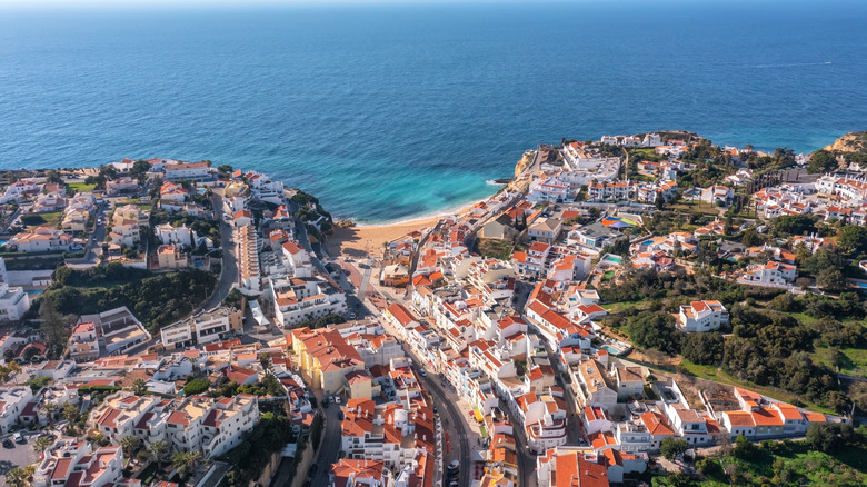Aerial view of the town of Carvoeiro and the ocean beyond