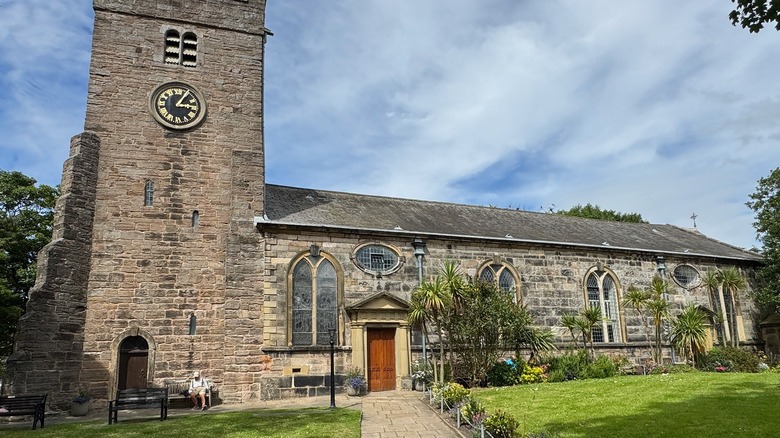 The 11th-century St. Chad's Church in Poulton-le-Fylde surrounded by a grassy lawn