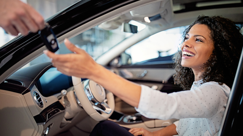 Woman receiving keys