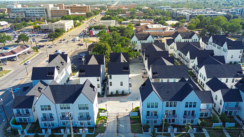 An aeriel shot of housing and buildings in Arlington, Texas