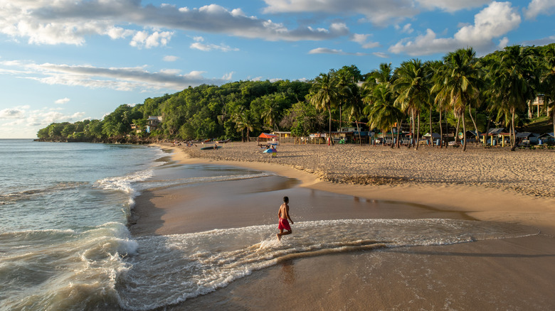 Person running through the waves at Crash Boat Beach in Aguadilla