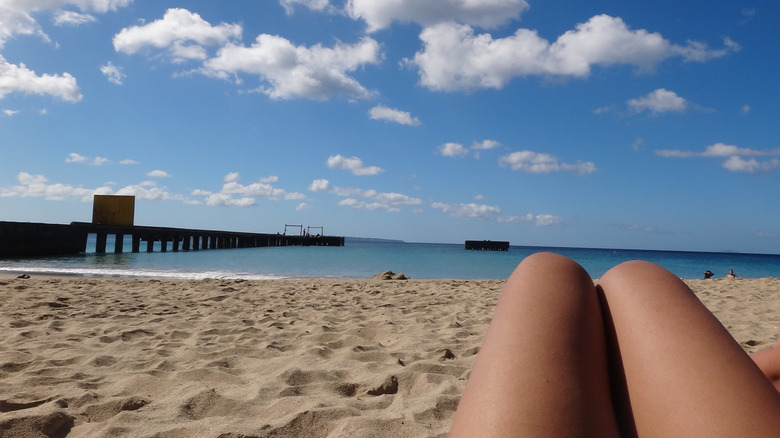 Beachgoer in sand at Crash Boat Beach