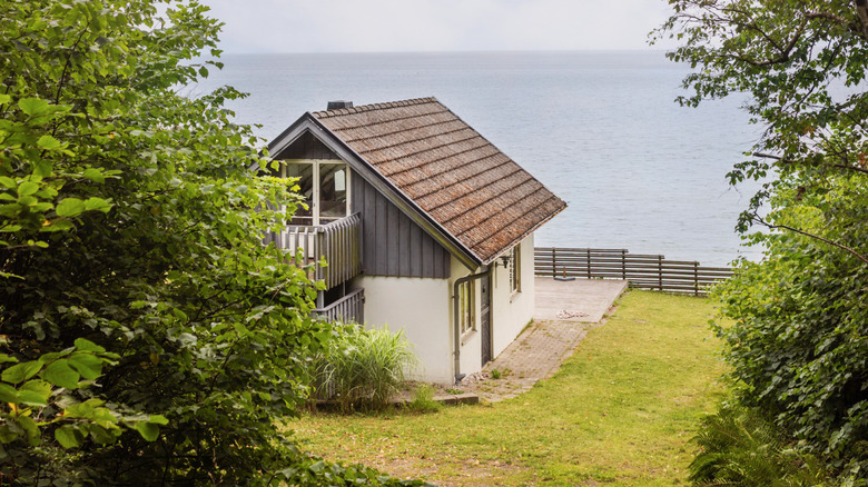A close-up of a cabin on a shore during a beautiful summer day in rural Sweden