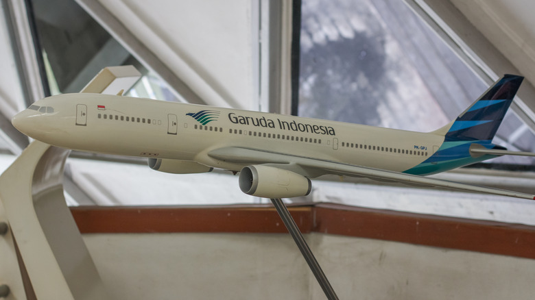 View of Garuda Indonesia Airplane Model Display miniature with blue tailfin