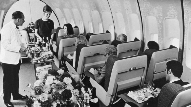 First class passengers in a BOAC Boeing 747 Jumbo Jet are served a luxury lunch.