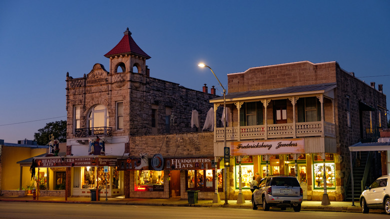 Downtown Fredericksburg, Texas, at night, featuring a blend of German and American West-style architecture