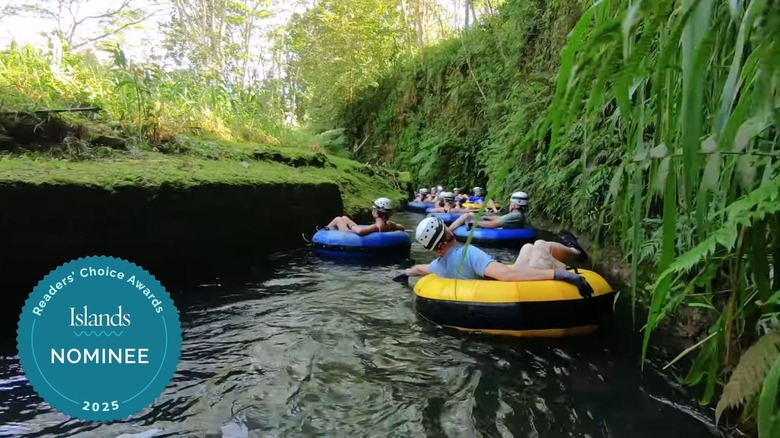 People tubing down river in Kauaʻi, Hawaii