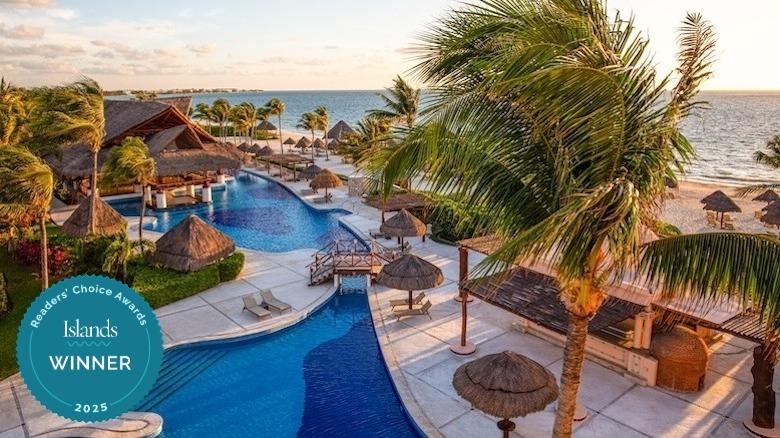 Excellence Riviera Cancun pool with beach backdrop
