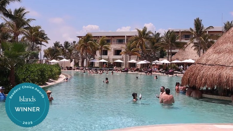 Guests enjoying a pool at Secrets Akumal Riviera Maya