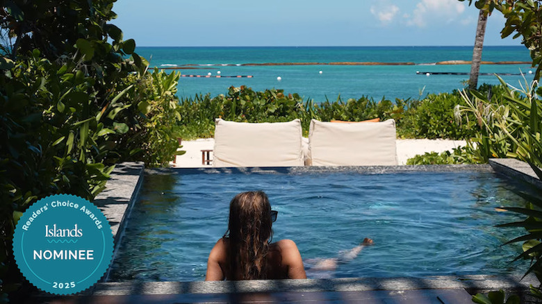 A woman soaking in a private pool overlooking the ocean at Banyan Tree Mayakoba