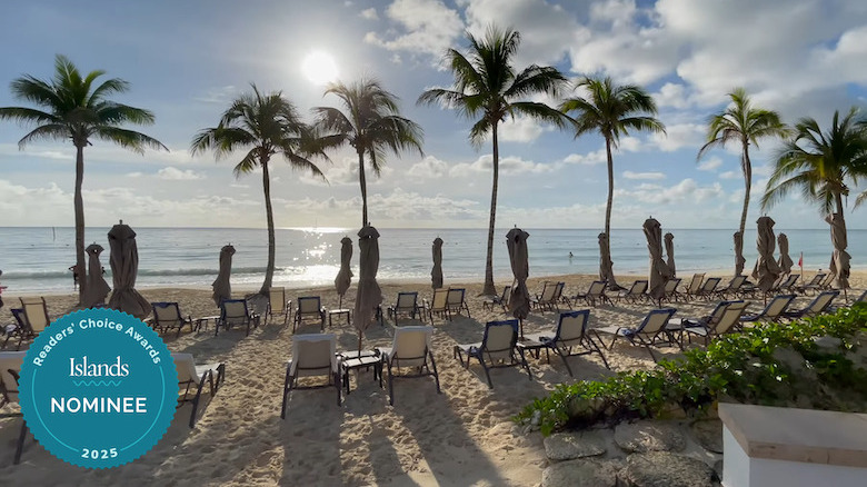 Loungers lined up on a sand beach at Grand Residences Riviera Cancun - All Inclusive