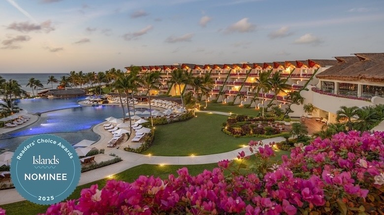 Grand Velas Riviera Maya entry with water feature and palm trees