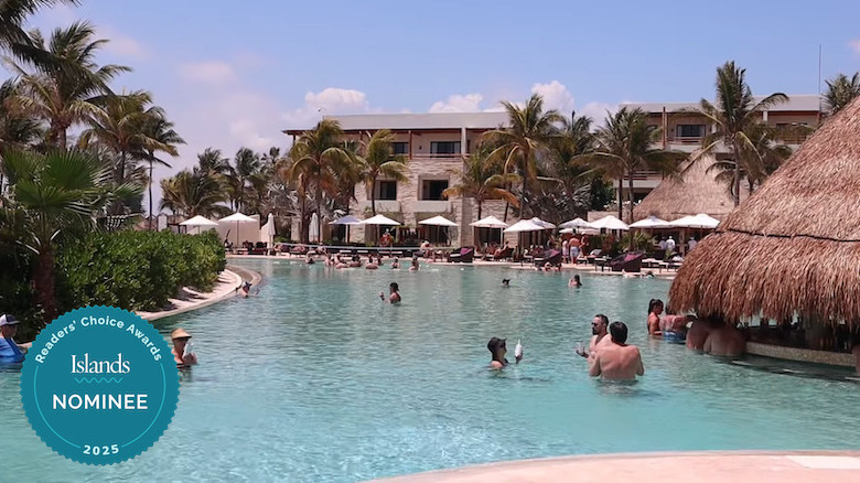 Guests enjoying a pool at Secrets Akumal Riviera Maya
