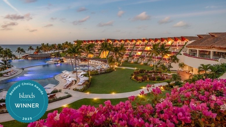 Grand Velas Riviera Maya entry with water feature and palm trees