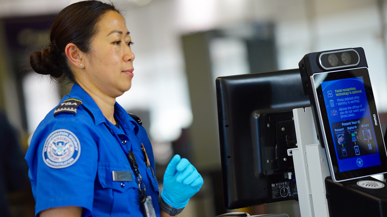 TSA agent conducting ID verification check