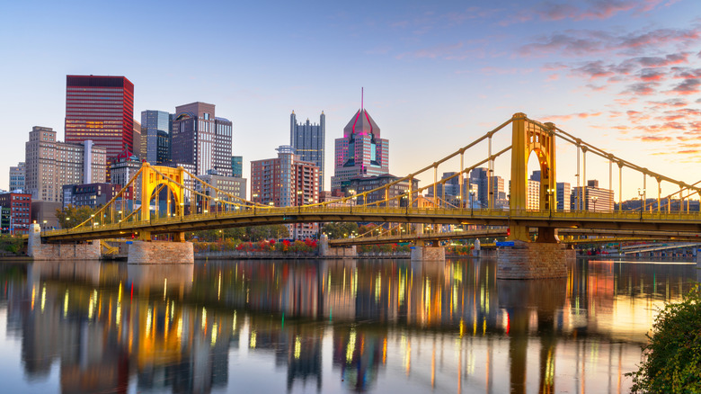 A skyline shot of Pittsburgh at dusk along the Ohio River