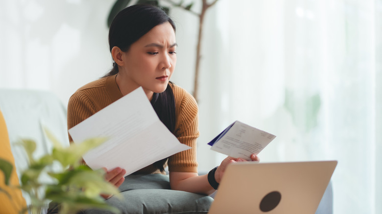 Frustrated woman trying to figure out her bills