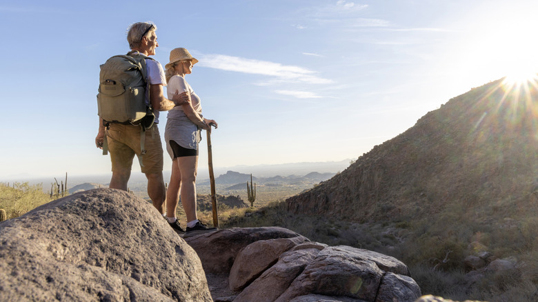 A retirement-aged couple hiking in the Arizona mountains