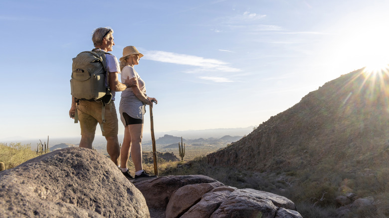 An older couple hiking together in Sedona, Arizona