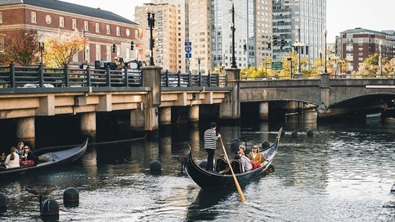 Two gondolas glide on the river in Providence, Rhode Island