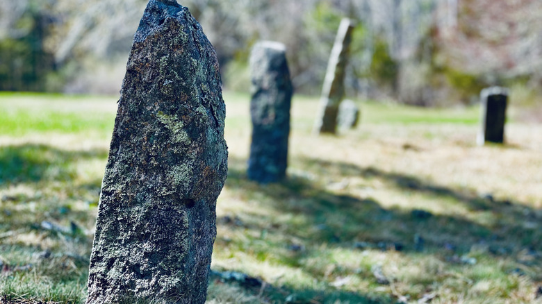 Weathered headstones mark resting places in a colonial graveyard in Rhode Island