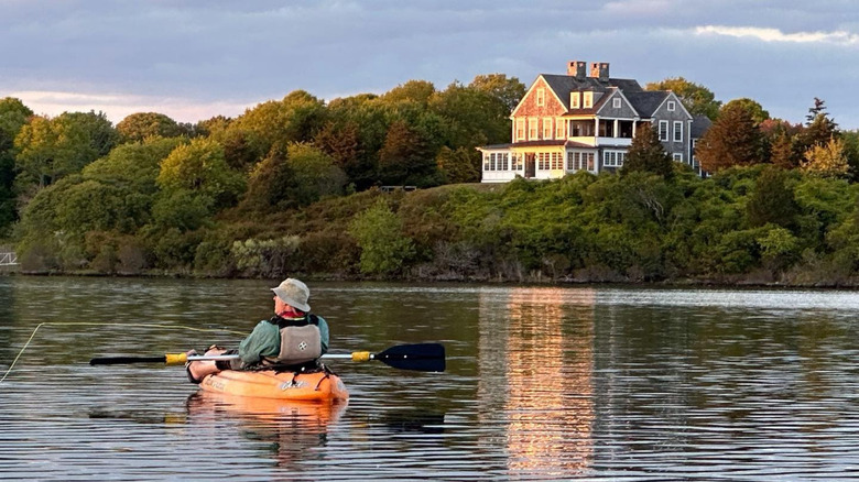 Man kayaking on Potter Pond in Rhode Island