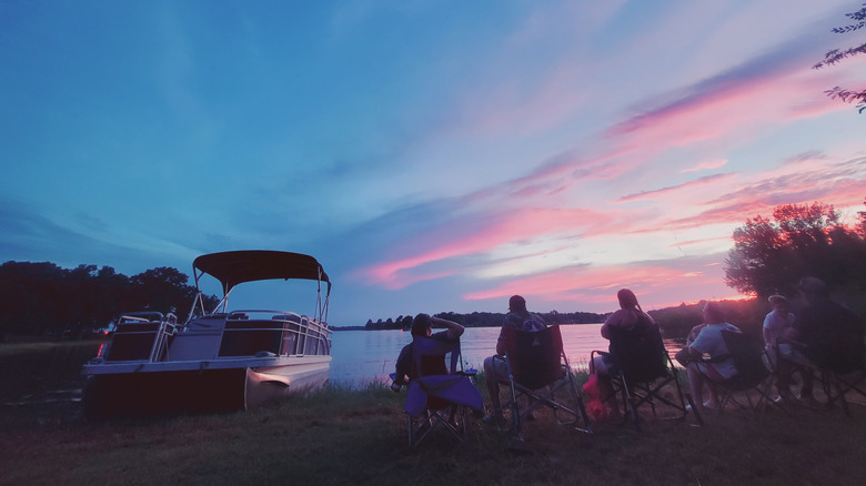 Guests watch the sunset at Fisherman's Cove Lodge on Richland-Chamber Lake in Texas