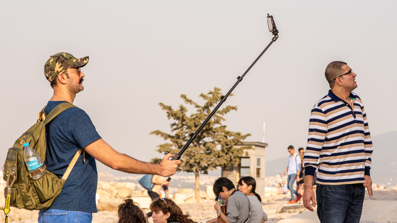 Man uses selfie stick at the Acropolis