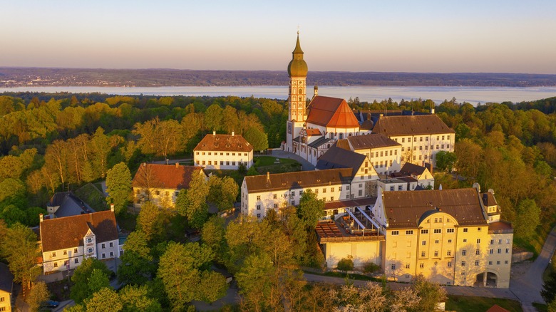 The Andechs Monastery looking over a lake during sunset in Germany