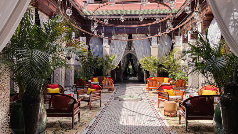The ambience inside the Royal Mansour, where Ross stays in the first episode of her new travel show, is colorful and lavish, decorated with yellow and red pillows, glass chandeliers, gauzy curtains, fine tilework, and bright green palms