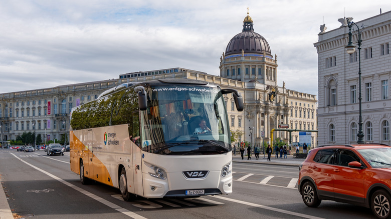 tour bus drives down German road