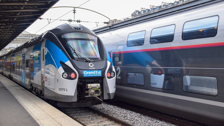 french train arriving at station
