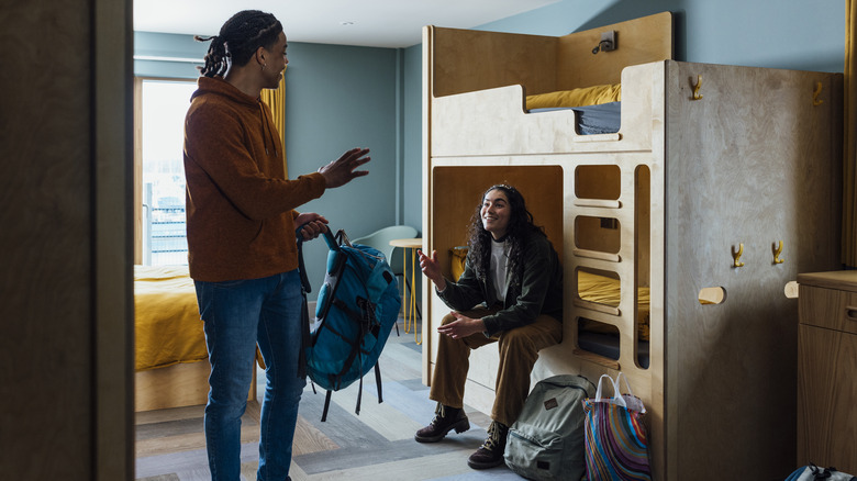 Travelers chatting in a European hostel