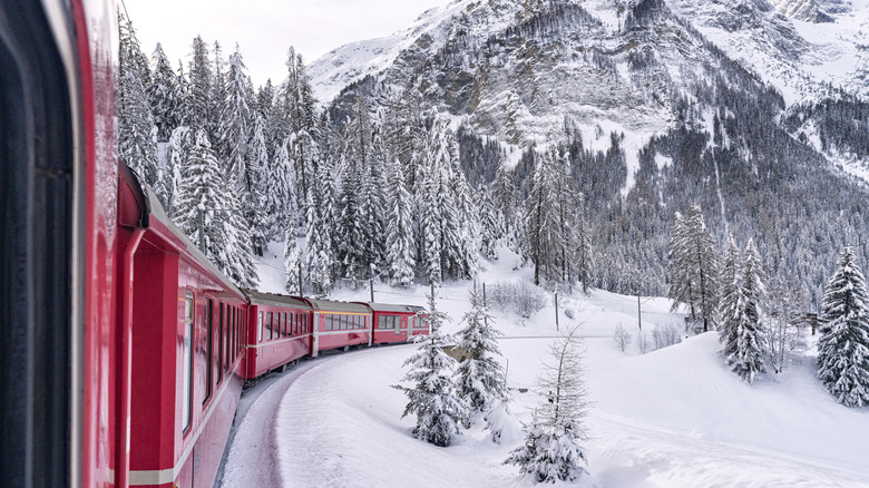 The Bernina Express train in a snowy landscape, Switzerland