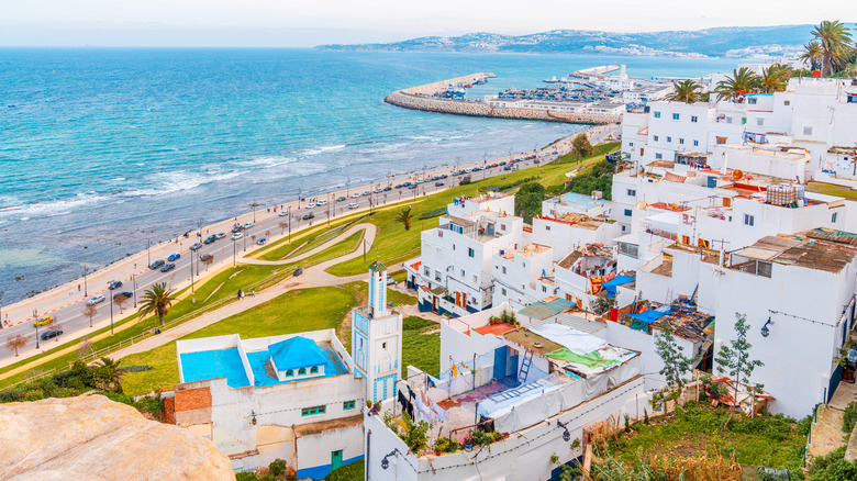White Residential buildings on a hill facing the Strait of Gibraltar in Tangier, Morocco