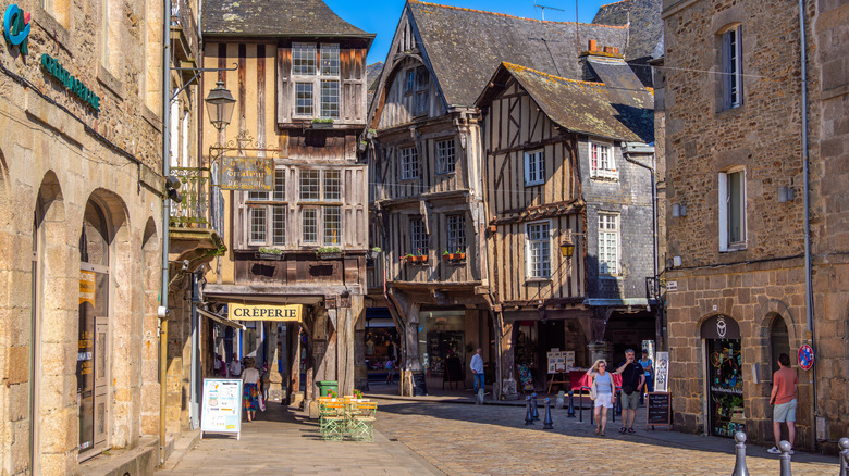 Medieval street in Dinan, France, with brick and wood architecture
