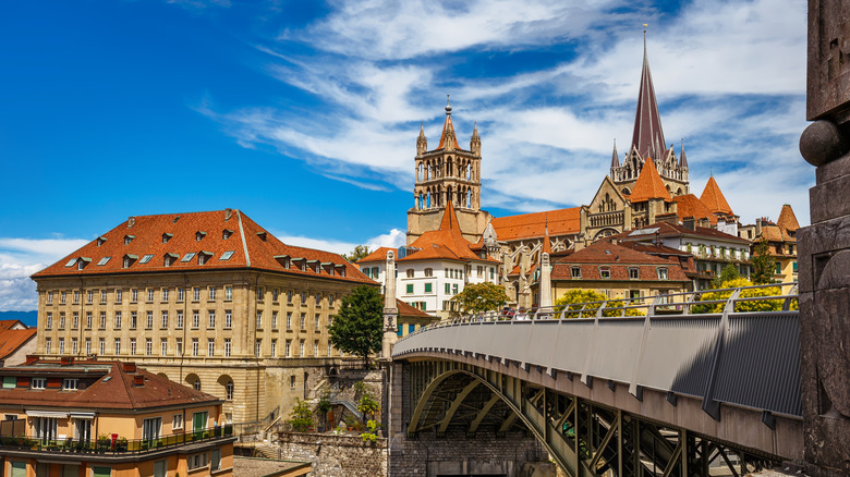 View of cathedrals and colorful buildings over a bridge in Lausanne, Switzerland