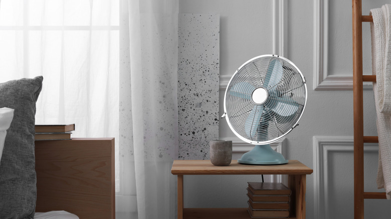 Fan on a table in a bedroom