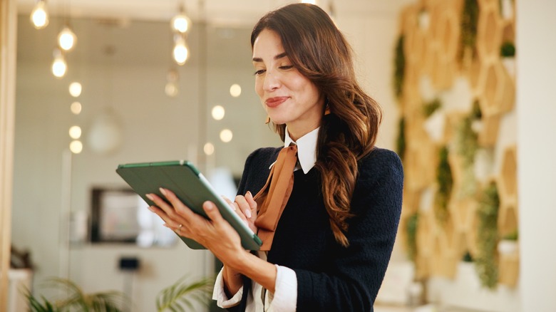 Woman in hotel using tablet