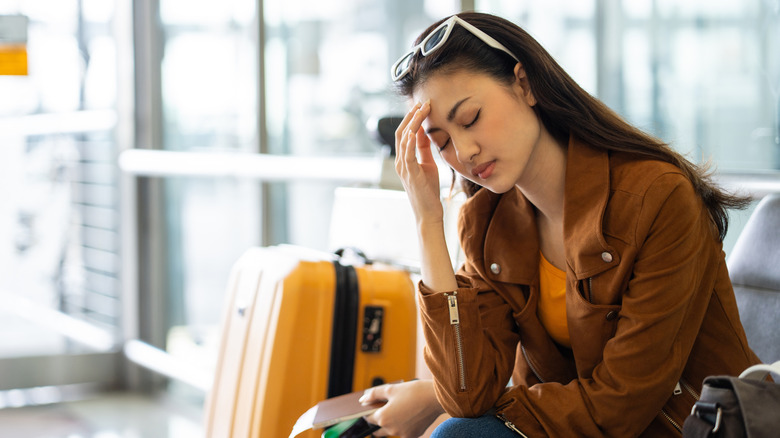 Unhappy young traveler at the airport