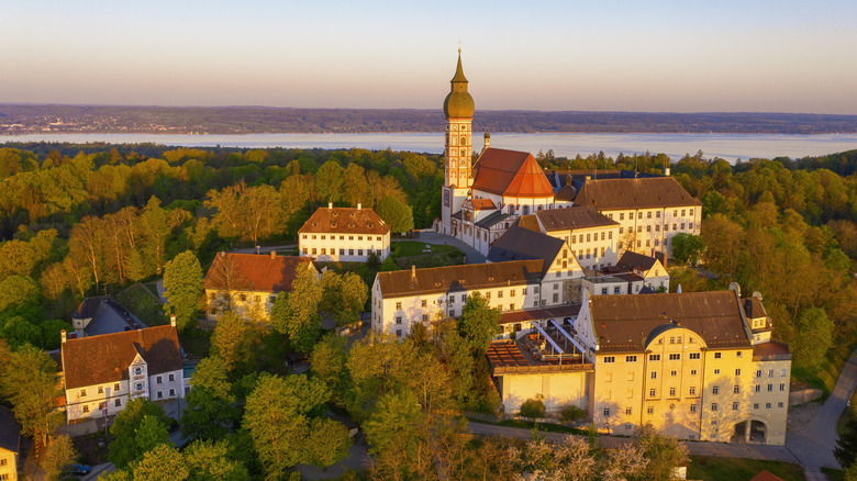 The Andechs Monastery looking over a lake during sunset in Germany