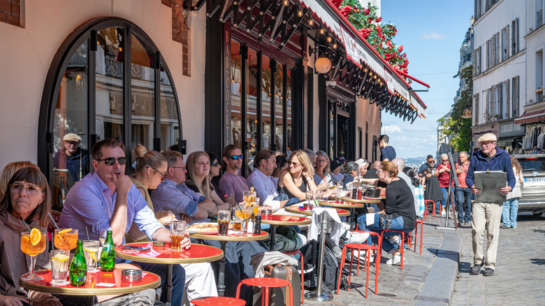 People eating at European cafe